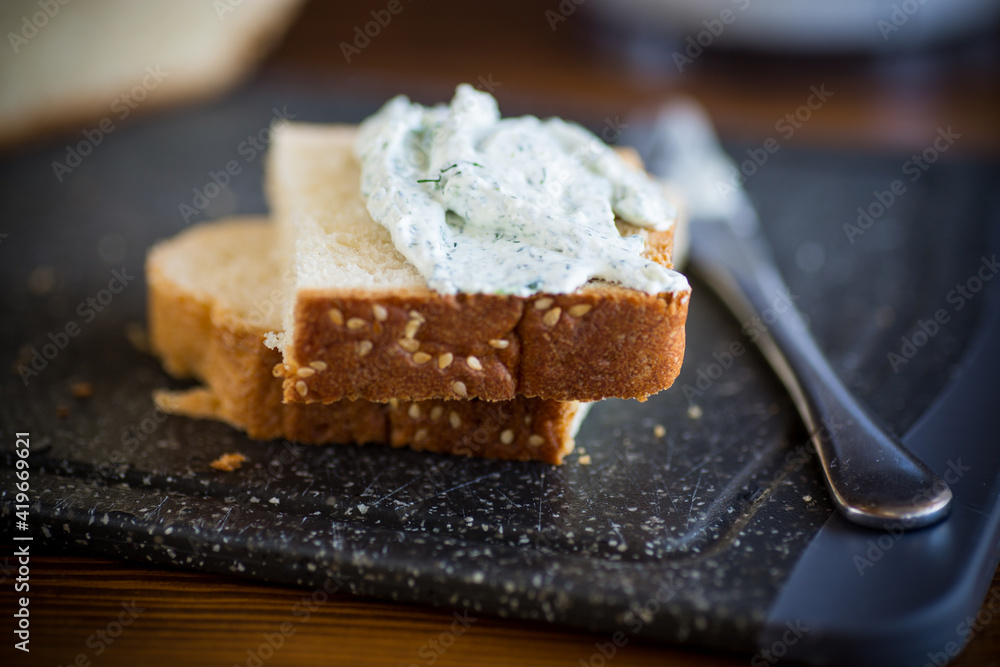 homemade salted curd spread with herbs and garlic