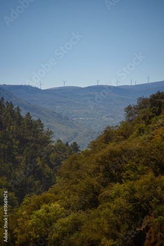 Mountain landscape with windmills on te background