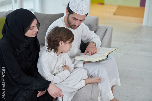 Young muslim family reading Quran during Ramadan