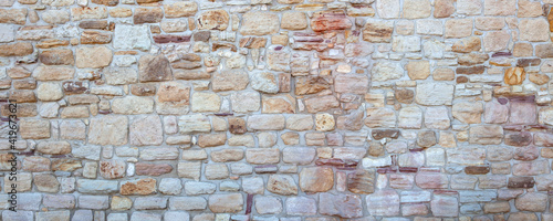 Modern Pattern Natural Wall of sandstone. Natural Decorative Stacked Stone Wall Texture. Natural Stone cladding. 