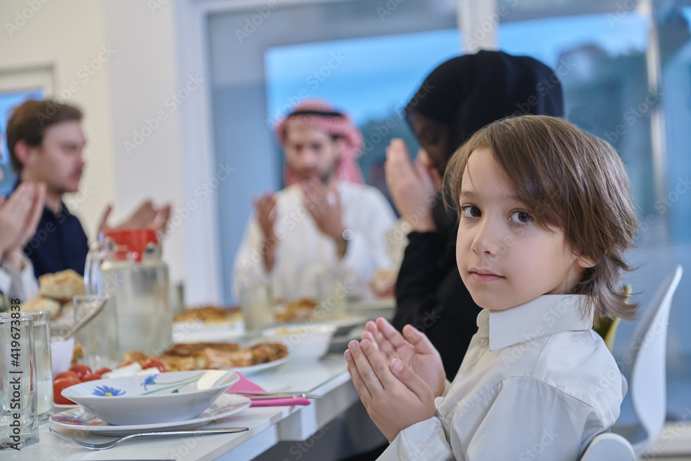 Muslim family making iftar dua to break fasting during Ramadan. Muslim family making iftar dua to break fasting during Ramadan.