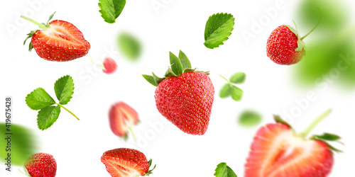 Fototapeta Naklejka Na Ścianę i Meble -  ripe strawberry group, slices and leaves on air