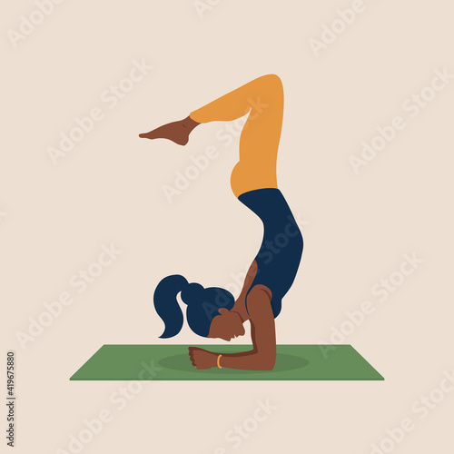 Young African-American woman plays sports on mat home. Beautiful black woman stands upside down, performs handstand. Black female character practicing in yoga studio or home. Flat vector illustration