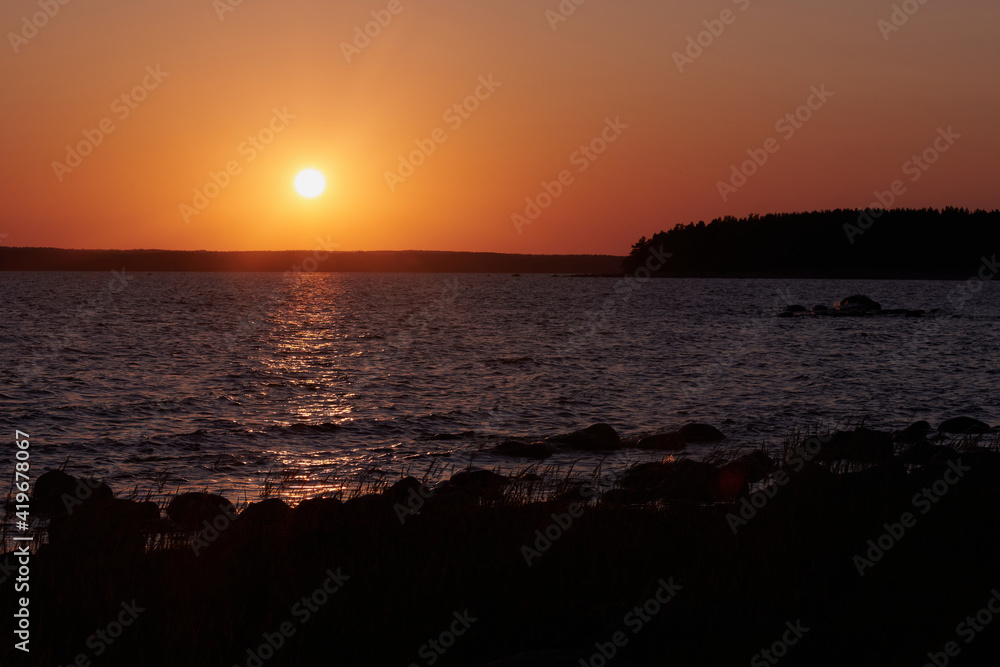 Beautiful sunset on the Gulf of Finland. Typical northern summer landscape.