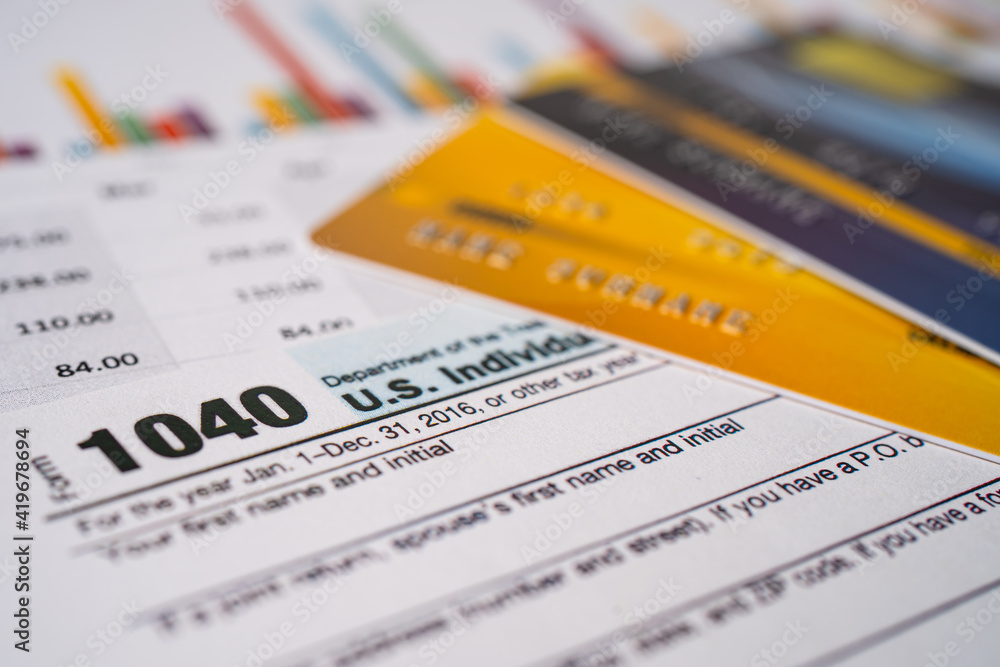 Obraz premium Tax Return form 1040 and dollar banknote, U.S. Individual Income.