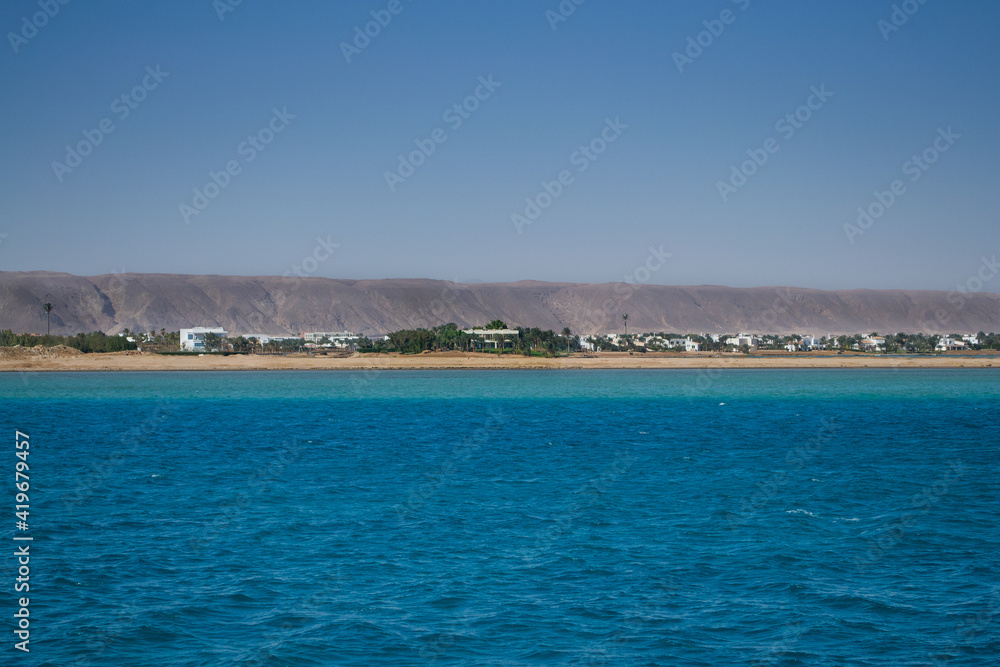 Fototapeta premium Red sea coral reef and blue sky. El Gouna, Egypt