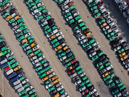 Top view of many cars used for crash testing parked in a row