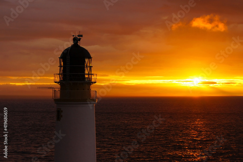 A lighthouse in Scotland near Melvaig during sunset