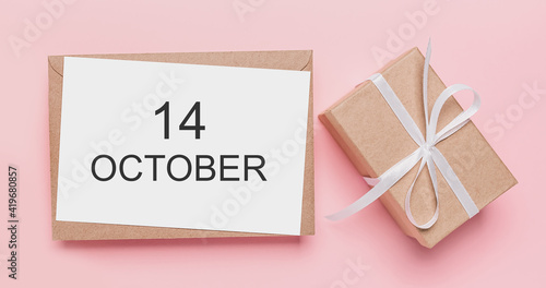 Gifts with note letter on isolated pink background, love and valentine concept with text 14 October