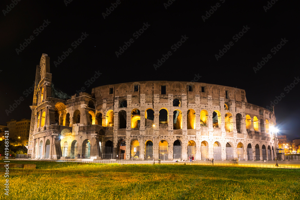 Ruins of the ancient Colosseum at night, Rome, Italy