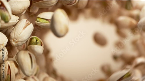 Super slow motion of flying pistachios in rotating movement. Filmed on high speed cinema camera, 1000fps.