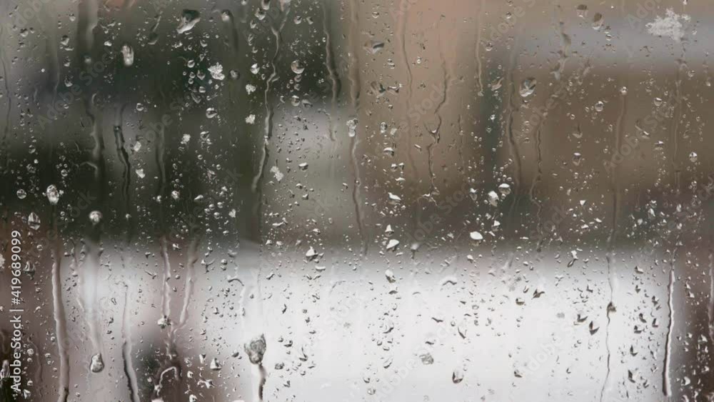 Close up macro view of raindrops with snow on a window pane. Beautiful spring backgrounds of nature. Sweden. Close up macro view of raindrops with snow on a window pane. Beautiful spring backgrounds of nature. Sweden.