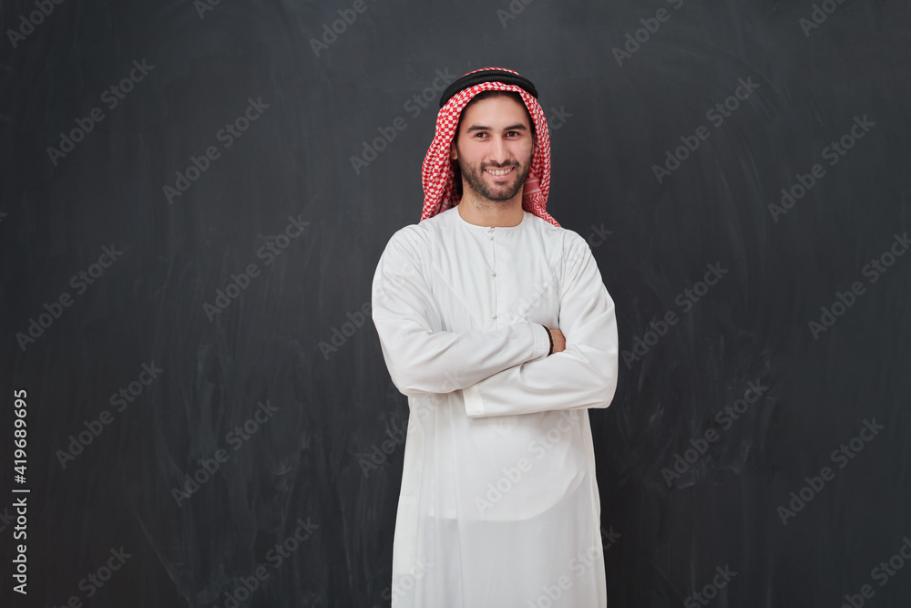 Young muslim man with crossed arms smiling Young muslim man with crossed arms smiling