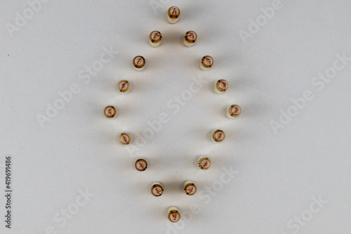 5.56mm bullets arranged in the shape of a diamond lit from both sides