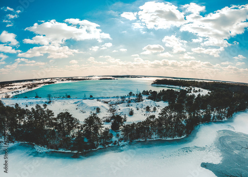 Aerial Shot of Snowy Landscape with Lake during Winter