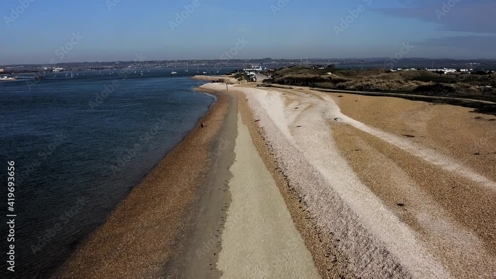 Aerial View along the wide beach and coastline of Hayling Island, a popular destination in Southern England for sailors and beachcombers.