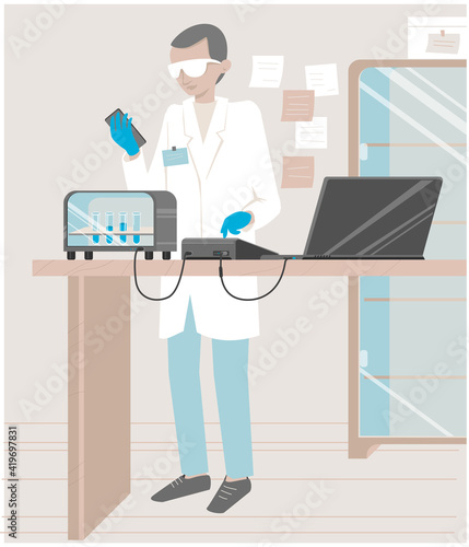 Young doctor conducts laboratory research. Doctor working with research equipment. 