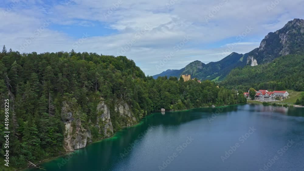 Aerial view of Bavarian Alpsee in summer. Alpsee near Neuschwanstein Castle in Schwangau. Aerial view of Bavarian Alpsee in summer. Alpsee near Neuschwanstein Castle in Schwangau.