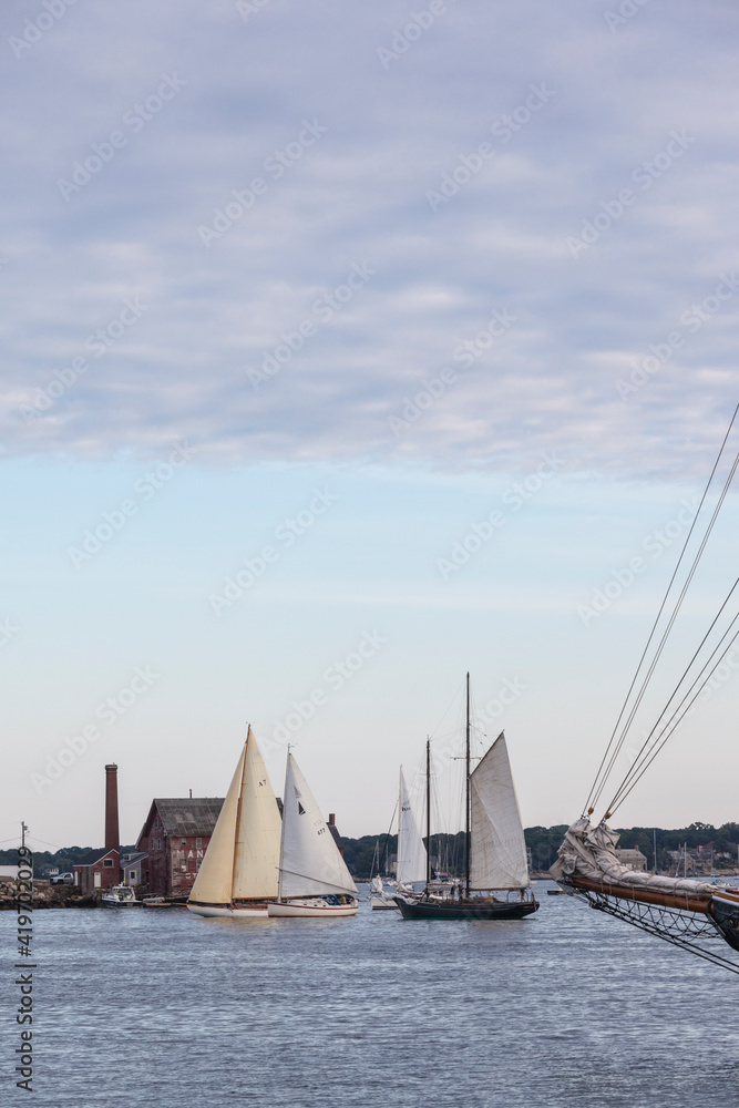 USA, Massachusetts, Cape Ann, Gloucester. Gloucester Schooner Festival, schooners in Gloucester Harbor at dusk