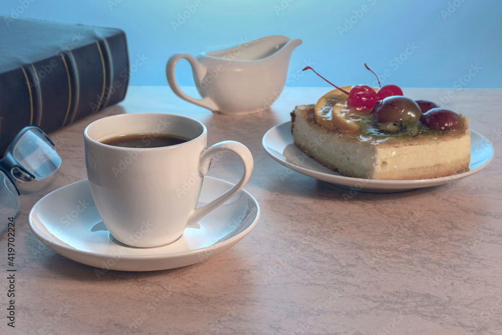 a cup of strong black coffee and a piece of delicious homemade cake on a plate on a wooden table a cup of strong black coffee and a piece of delicious homemade cake on a plate on a wooden table