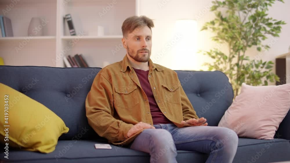 Worried man waiting for message, looking at smartphone, feeling nervous, stress Worried man waiting for message, looking at smartphone, feeling nervous, stress