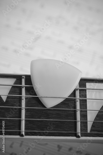 Guitar with Pick - close-up photo