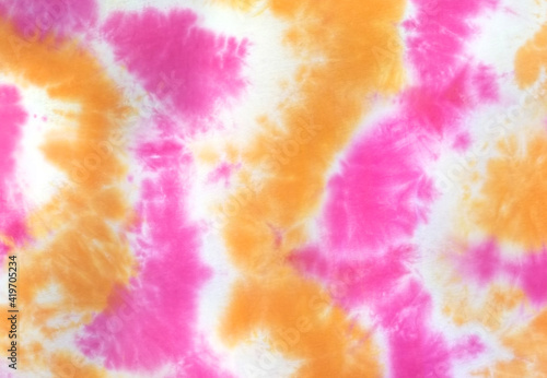 Fotografie Tie Dye 2 Tone Clouds Close Up Shot fabric texture background Pink Yellow
