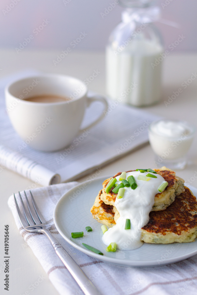 Breakfast with coffee and milk and cheese pancakes. Healthy food