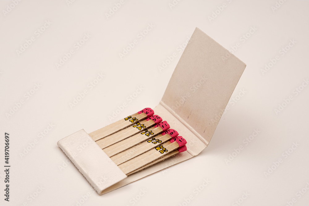matchsticks with faces painted on the heads on white on white matchsticks with faces painted on the heads on white on white