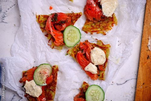 Gravlax on potato pancakes.style rustic photo