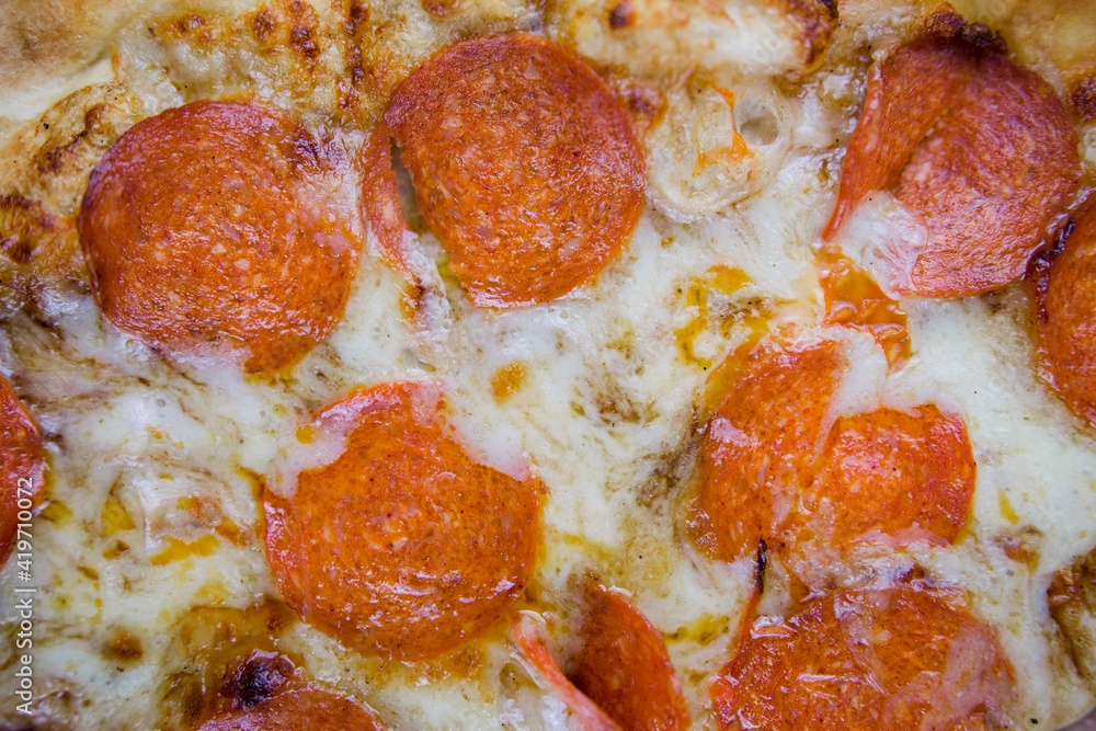 pizza with pepperoni closeup texture with cheese pizza with pepperoni closeup texture with cheese