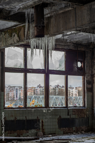 an abandoned production facility with ice build-up inside © Alexei