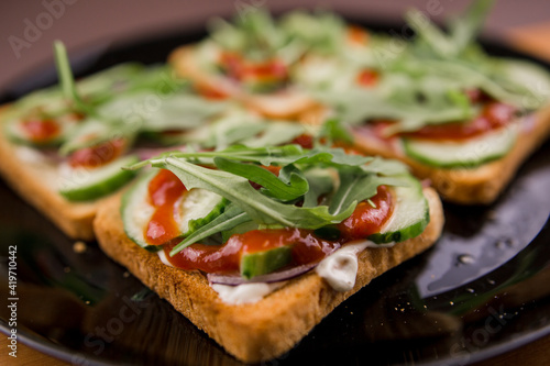 delicious rocket salad sandwiches on a plate