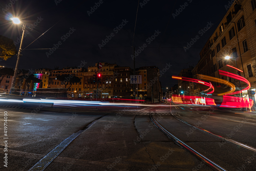 Cool long exposure cars traffic neon light trails, night view, Rome, Italy