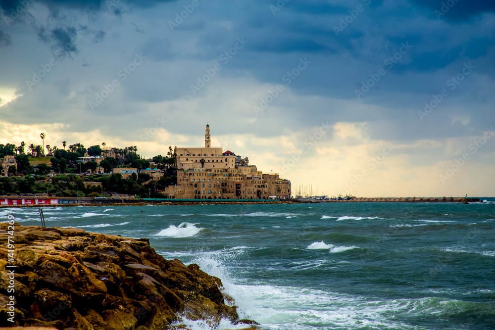 Tel Aviv, Israel - March 04, 2021: view of the old city of Jaffa in inclement weather, dark clouds above it