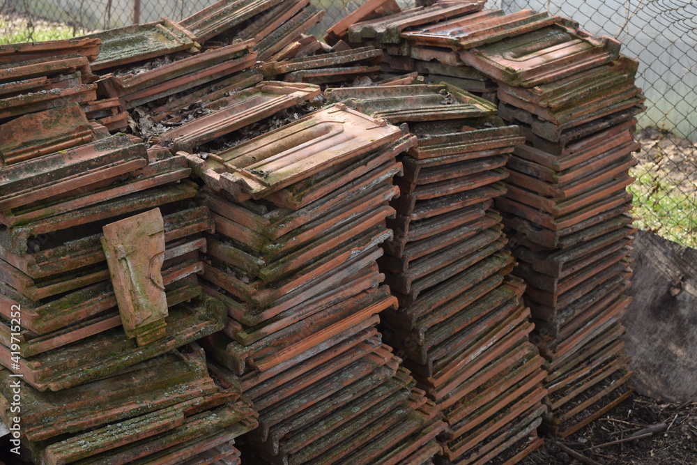 Old roof tiles in stacks.