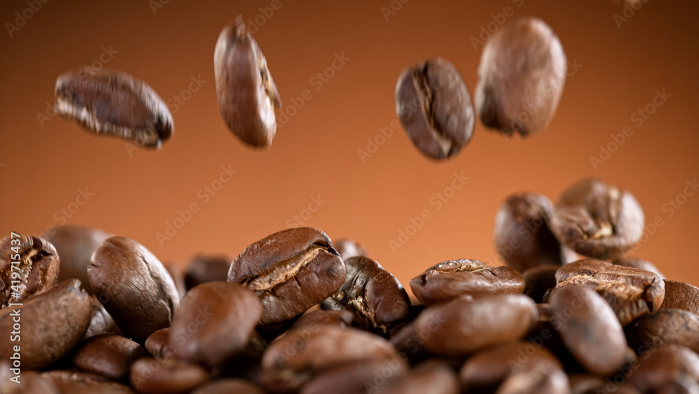 Falling Roasted Coffee Beans, Macro Shot, close-up. Falling Roasted Coffee Beans, Macro Shot, close-up.