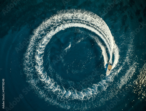 Speed boat in mediterranean sea making a cyrcle from bubbles, aerial view © Lukas Gojda