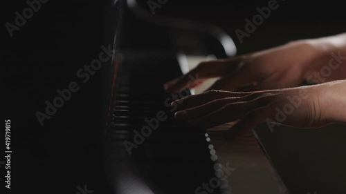 Piano music pianist hands playing. Musical instrument grand piano details. photo