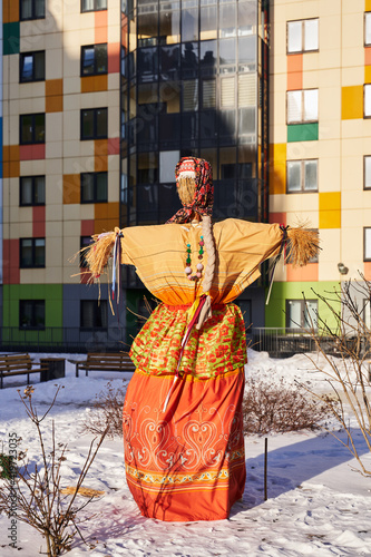 pagan holiday in modern Russia. Maslenitsa. a female figure made of hay in traditional dress  symbolizing the winter before the burning.