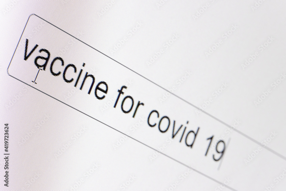 Search bar on a computer monitor with the question Vaccine for covid 19. Searching for information on the Internet, close up. Search bar on a computer monitor with the question Vaccine for covid 19. Searching for information on the Internet, close up.