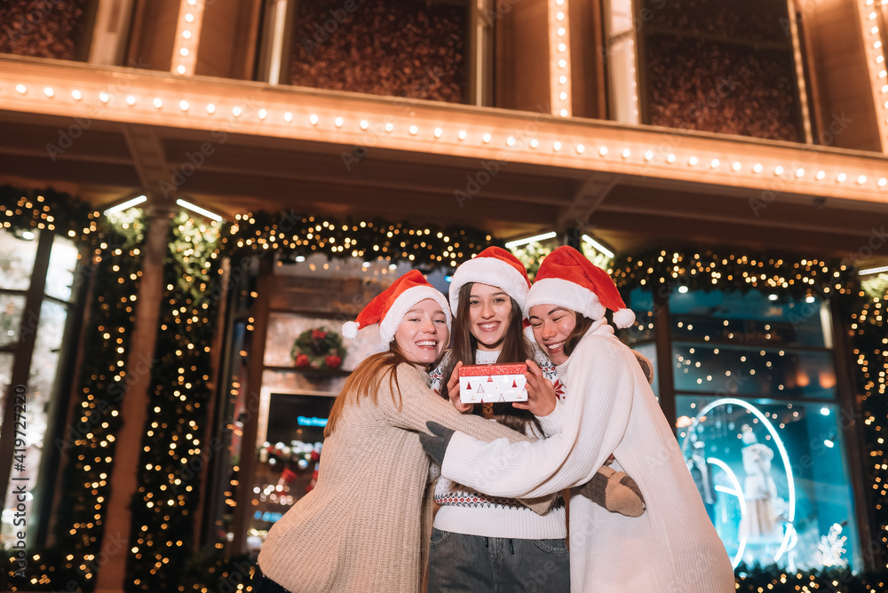 Portrait of happy cute young group of friends hugging each other Portrait of happy cute young group of friends hugging each other
