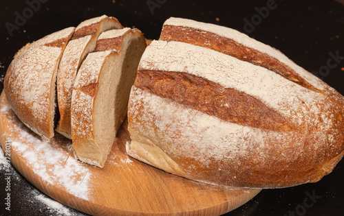 Fresh bread on the kitchen table, bakery or homemade baking concept.
