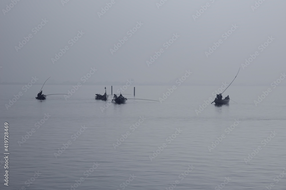 Naklejka premium Traditional fishing boats during toil