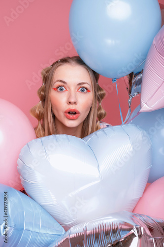 Young attractive girl in balloons