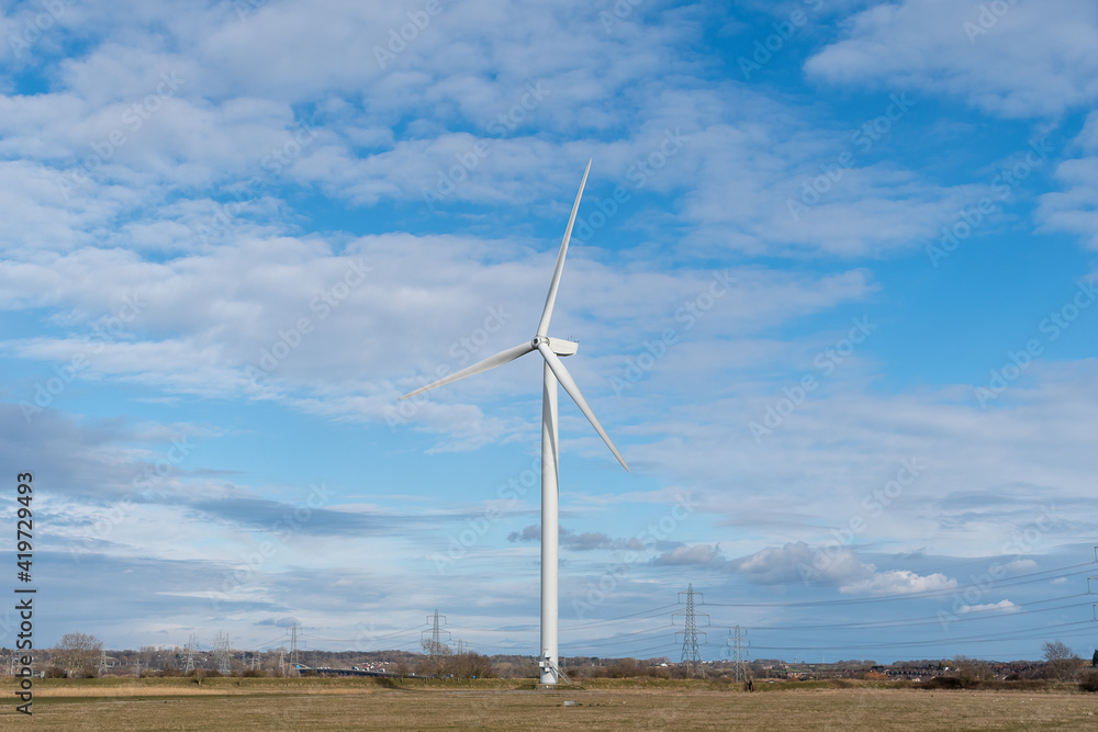 Renewable energy wind turbine in a field Renewable energy wind turbine in a field
