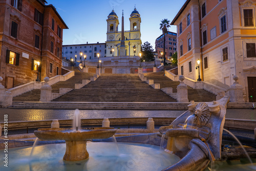 Italy, Rome, Spanish Steps, Barcaccia Fountain on Piazza di Spagna, City at dawn photo