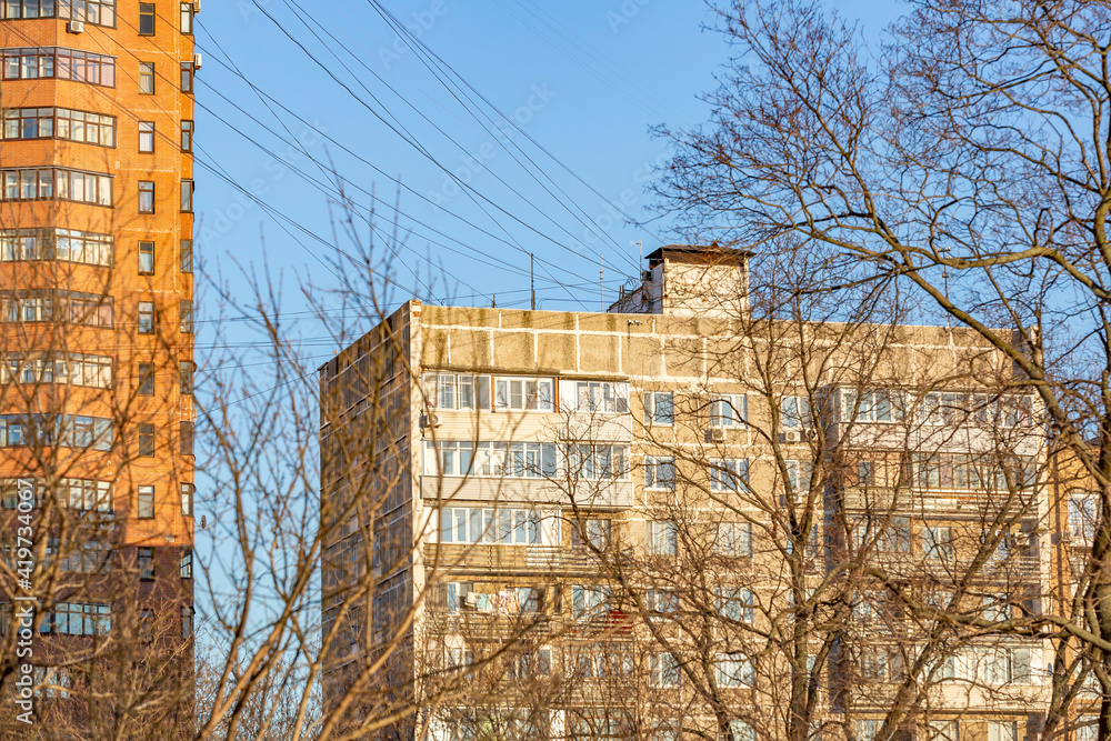 Old-fashioned brick multi-storey building. Typical Eastern European architecture of the late 20th century Old-fashioned brick multi-storey building. Typical Eastern European architecture of the late 20th century
