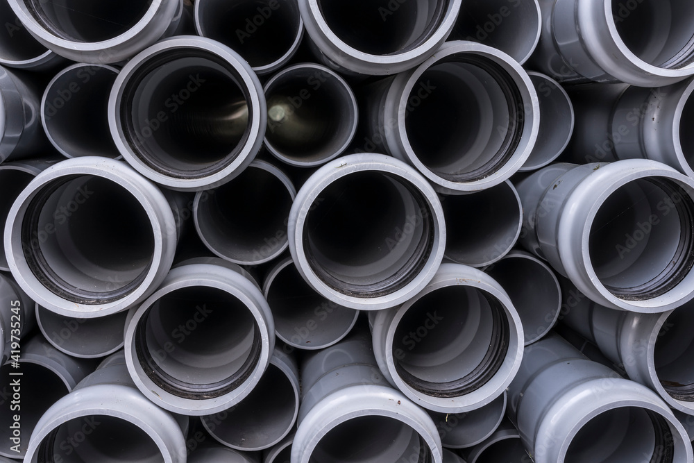 Stack of plastic pipes on a construction site. Stack of plastic pipes on a construction site.
