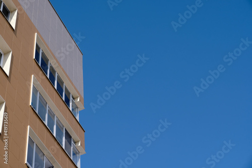 part of high-rise building against the blue sky. Copy space image.